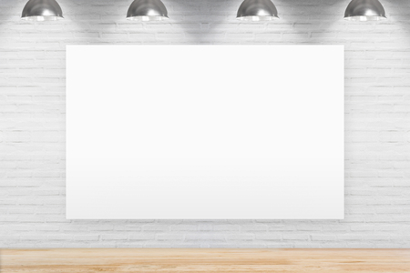 Blank chalkboard on brick wall in room with wooden floor with lamps.の写真素材