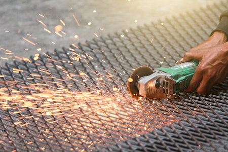 Electric wheel grinding on steel structure on sieve.の写真素材