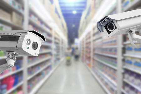 CCTV Security camera shopping department store on background.の写真素材