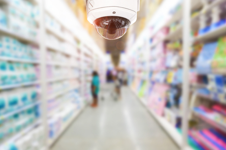 CCTV Security camera shopping department store on background.の写真素材