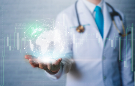 Doctor in hand holding global network connection with modern virtual screen interface.の写真素材