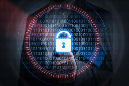 Businessman hand pressing lock icon with binary code, security concept.の写真素材