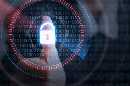 Businessman hand pressing lock icon with binary code, security concept.の写真素材