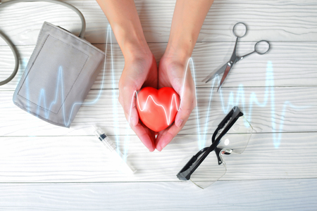 Hands holding red heart  with medical injection. medical conceptの写真素材