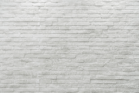 Abstract weathered textured white brick wall backgroundの写真素材