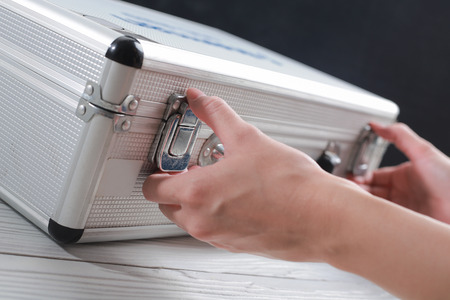 Hands business open luggage storage and documents.の写真素材