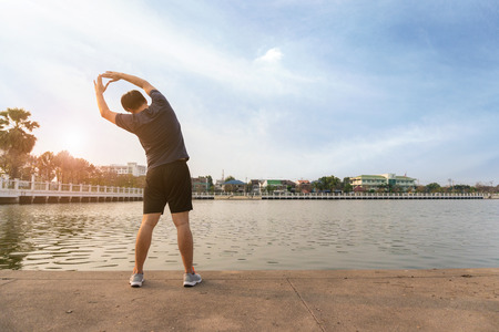 Young man runner stretching and exercise healthy lifestyle.の写真素材