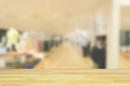 Wood table, shelf and blurred store with bokeh background.の写真素材