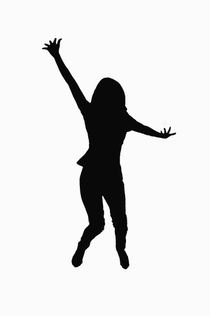 Motion concept - Young woman jumping in air over white background.の写真素材