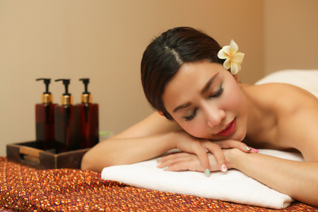 Young woman relaxing in the massage spa.の写真素材