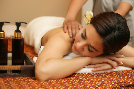 Young woman relaxing in the massage spa.の写真素材