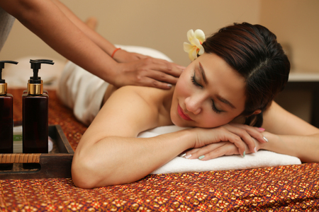 Young woman relaxing in the massage spa.の写真素材