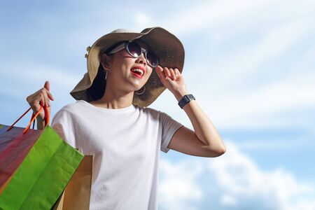 Happy woman with shopping bags enjoying in shopping. lifestyle conceptの写真素材