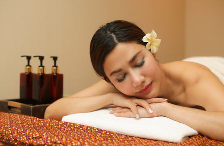 Young woman relaxing in the massage spa.の写真素材