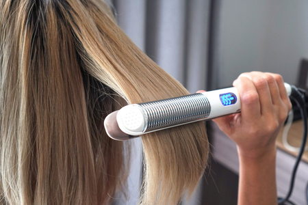 Hair iron straightening beauty care salon spa.の写真素材