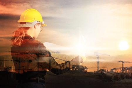 Double exposure of Engineer or with industrial tool on background.の写真素材