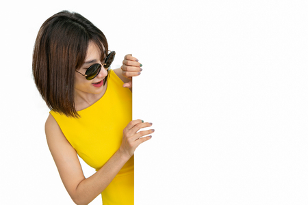 Beautiful girl holding empty blank board isolated white backgroundの写真素材