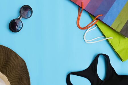 Female shopping summer outfit on blue background background.の写真素材
