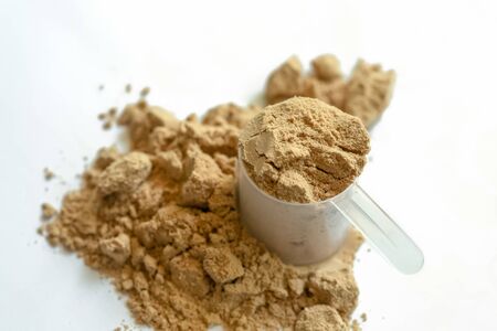 Scoop of whey protein with isolated white background.の写真素材