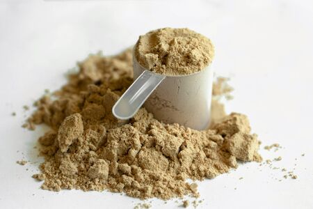 Cocoa protein powder isolated over the white background.の写真素材