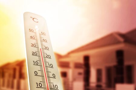 Heat wave in the house thermometer shows in summer.の写真素材