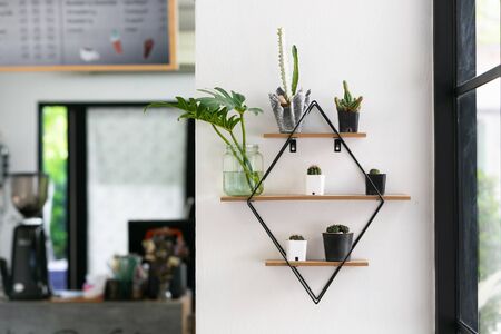 Modern cafe interior with shelfs white wall concrete.の写真素材