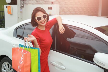 Happy woman with shopping bags enjoying in shopping outdoor.の写真素材
