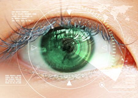 Close-up of woman's brown eye. High Technologies in the futureの写真素材