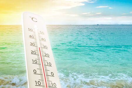 Heat wave on the beach thermometer shows in summer.の写真素材