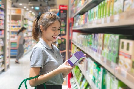 Asian Woman buying products in food supermarketの写真素材