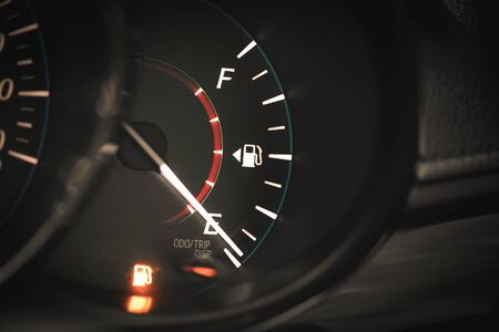 Low Fuel gauge showing fuel dashboard.の写真素材