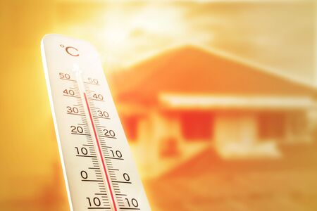 Heat wave in the house thermometer shows in summer.の写真素材