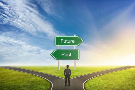 Businessman Concept of choose the correct way. Between Past or future.の写真素材
