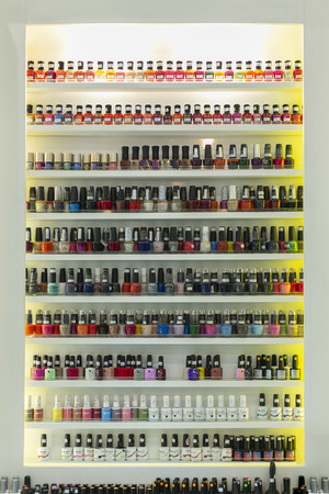 NAKHONRATCHASIMA, THAILAND SEP 01, 2019: Set of different nail varnishes on shelves in cosmetic store.のeditorial素材