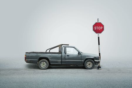 Car get damaged by accident crash sigh stop post on the road.の写真素材