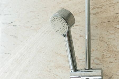 Close up of water shower faucet in the bathroom.の写真素材