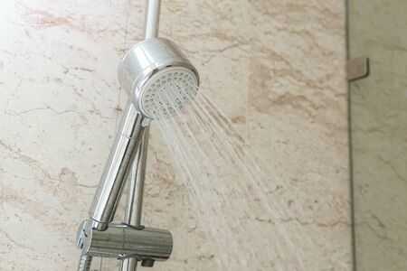 Close up of water shower faucet in the bathroom.の写真素材