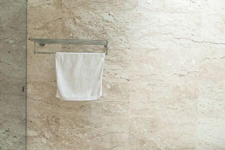 Clean towels on rack in the bathroom.の写真素材