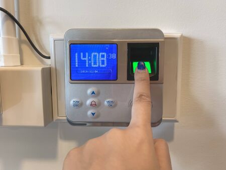 Finger print scan for unlock door security system. Record working timeの写真素材