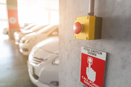 Emergency Alarm button at car park complex for security alert and crime control.の写真素材