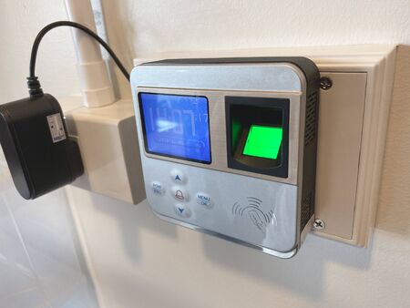 Finger print scan for unlock door security system. Record working timeの写真素材