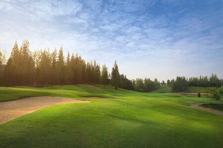 Sand bunkers at the beautiful golf course at the hill side at sunset, sunrise time.の写真素材