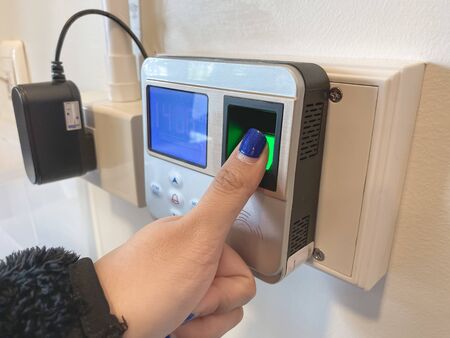 Finger print scan for unlock door security system. Record working timeの写真素材