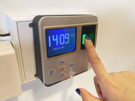 Finger print scan for unlock door security system. Record working timeの写真素材