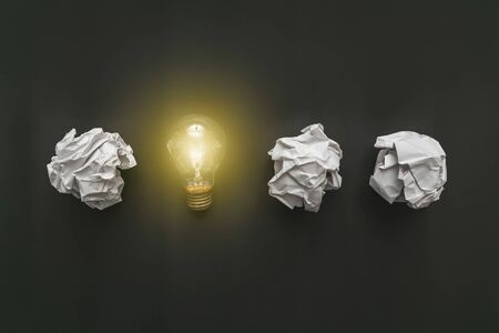 Cumpled paper on the blackboard turned into a light bulb. New idea conceptの写真素材