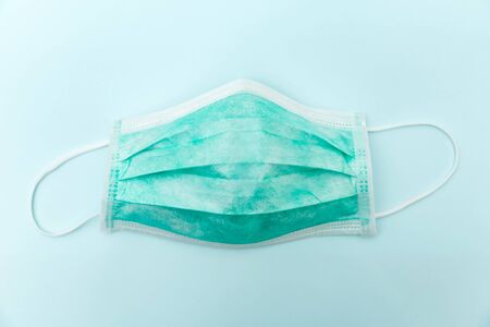 Surgical ear-loop green masks. Personal hygiene concept. Top viewの写真素材