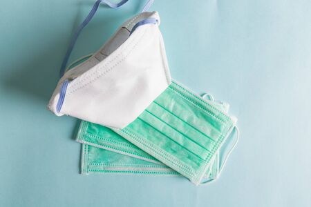 Surgical ear-loop green masks. Personal hygiene concept. Top viewの写真素材