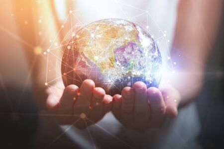 Woman holding in hands with global connection concept. technology conceptの写真素材