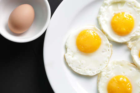 Four fried eggs for healthy breakfast. top viewの写真素材