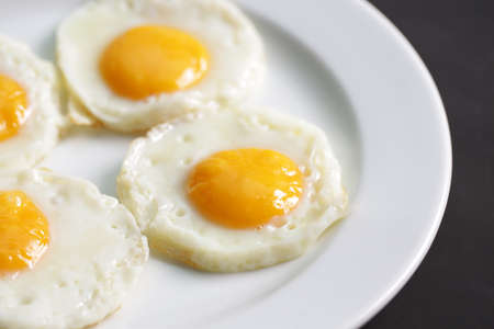 Four fried eggs for healthy breakfast.の写真素材